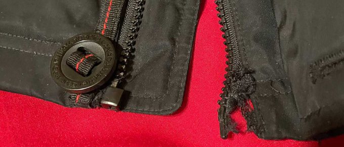 Damaged zipper and starter pin on jacket